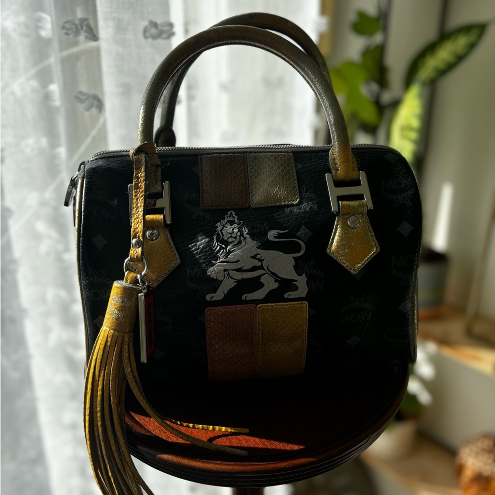 MCM Black and Gold Satchel with Tassel Accent